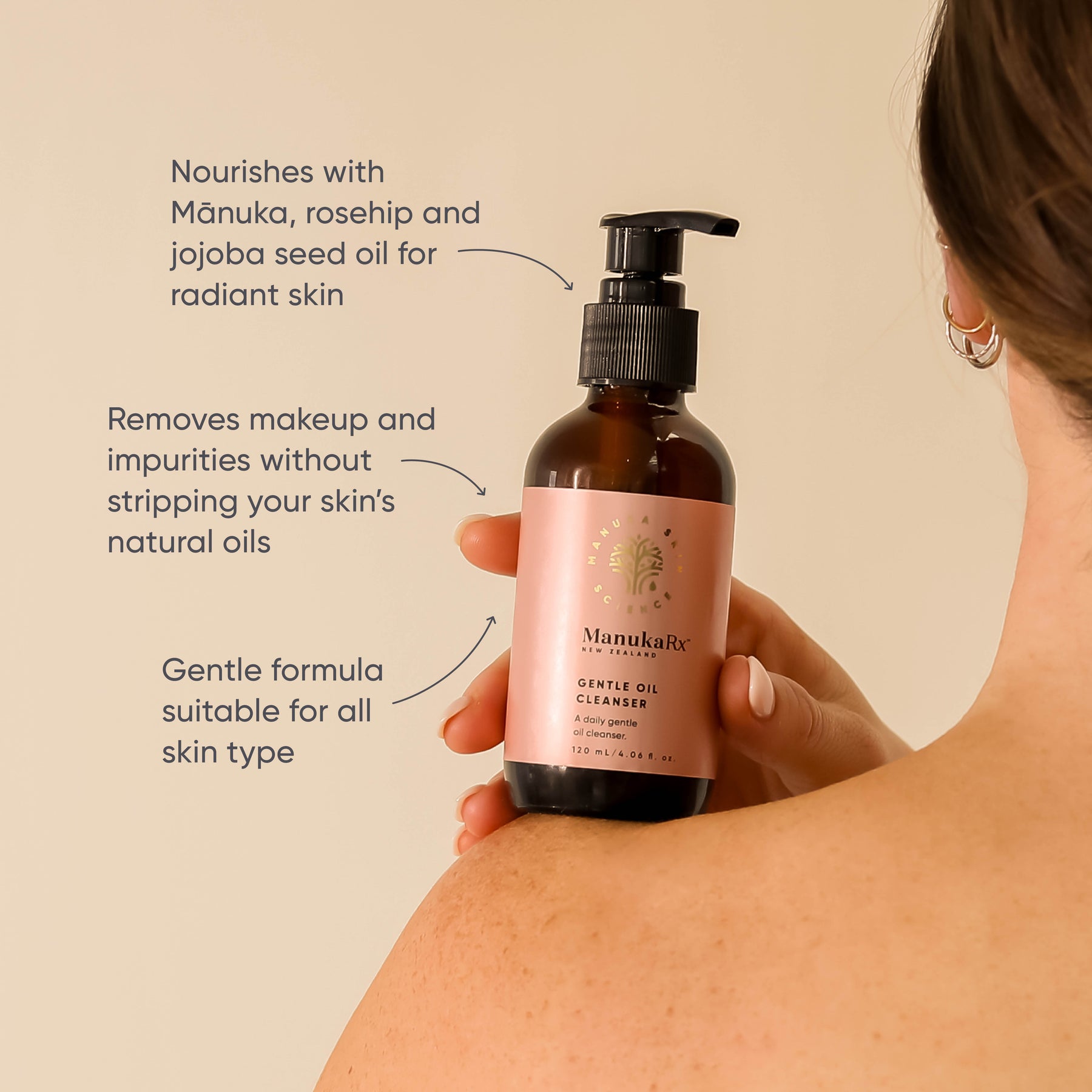 Woman holding bottle of ManukaRx Gentle Cleanser with product benefits listed around the bottle 