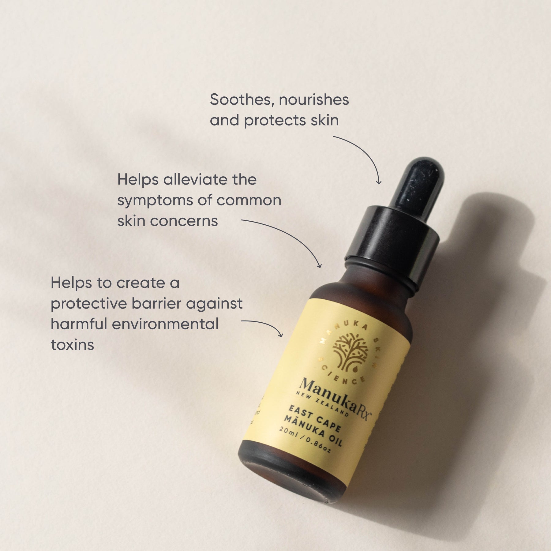 ManukaRx Manuka Face Oil Blend product benefits listed around oil bottle lying on a cream coloured background